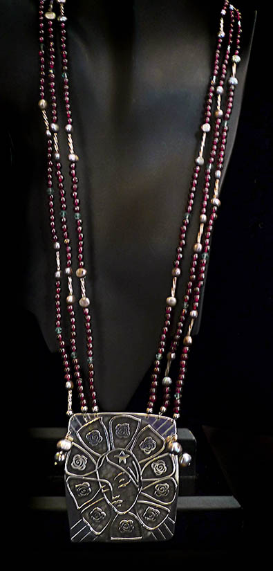 Our Lady of Guadalupe in sterling silver, garnets, pearls and crystal